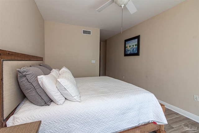 bedroom with ceiling fan and light hardwood / wood-style floors