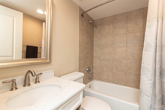 full bathroom featuring shower / bath combo with shower curtain, vanity, and toilet