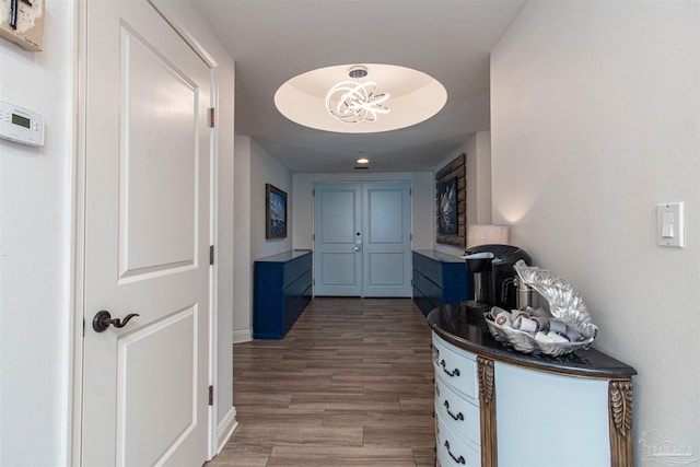 hallway with hardwood / wood-style flooring