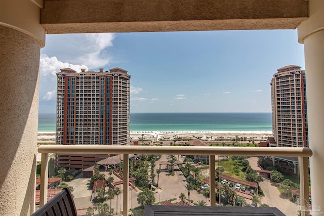 balcony with a beach view and a water view