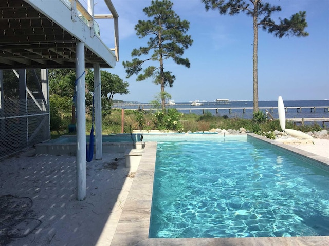 view of pool featuring a water view