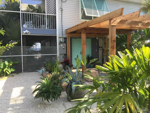 view of side of home featuring a pergola