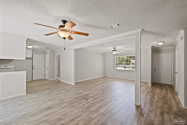 unfurnished living room with light hardwood / wood-style floors, ornamental molding, a textured ceiling, and ceiling fan