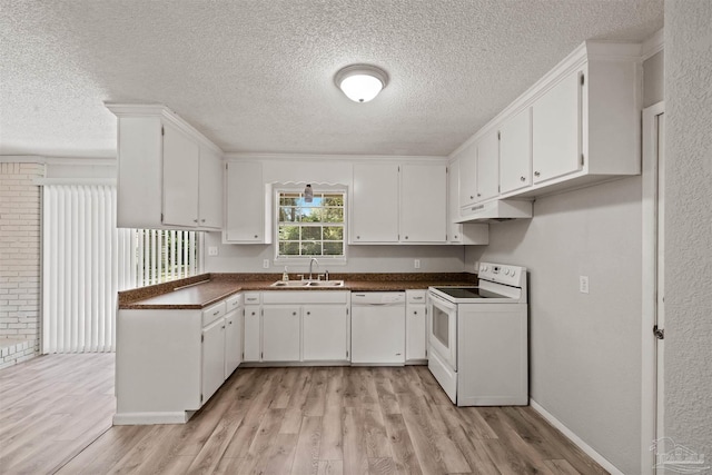 kitchen featuring light wood-type flooring, sink, white appliances, and white cabinetry