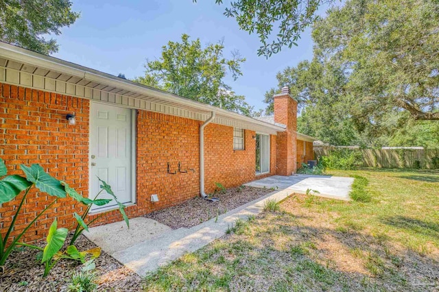 exterior space featuring a yard and a patio area