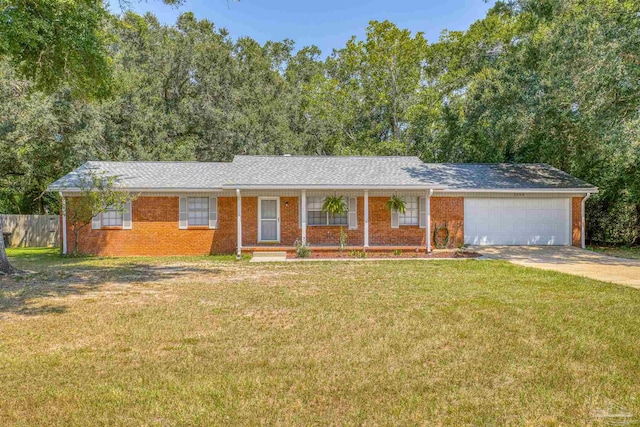 ranch-style home with a garage and a front yard