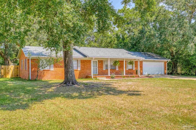 ranch-style home with a front lawn and a garage