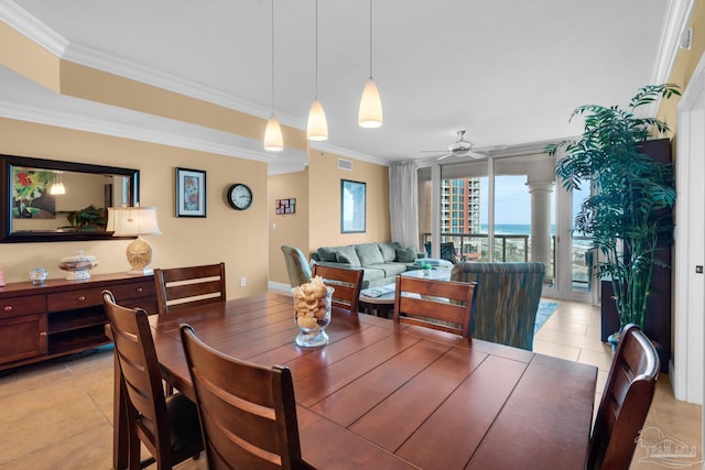 dining area featuring a ceiling fan, crown molding, visible vents, and light tile patterned floors