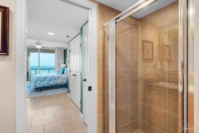ensuite bathroom with a ceiling fan, a stall shower, connected bathroom, tile patterned flooring, and recessed lighting