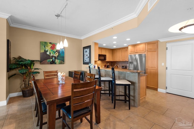 dining room with light tile patterned floors, baseboards, crown molding, and recessed lighting