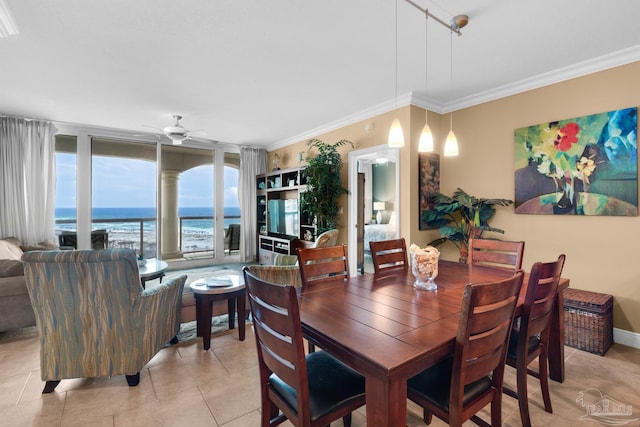 dining room featuring ceiling fan, crown molding, and light tile patterned floors