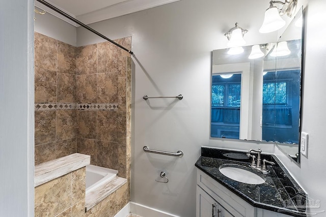 bathroom featuring tub / shower combination and vanity