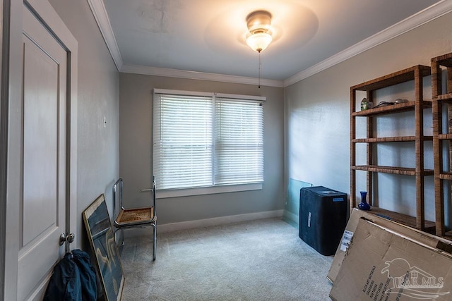 interior space with baseboards, carpet floors, and crown molding