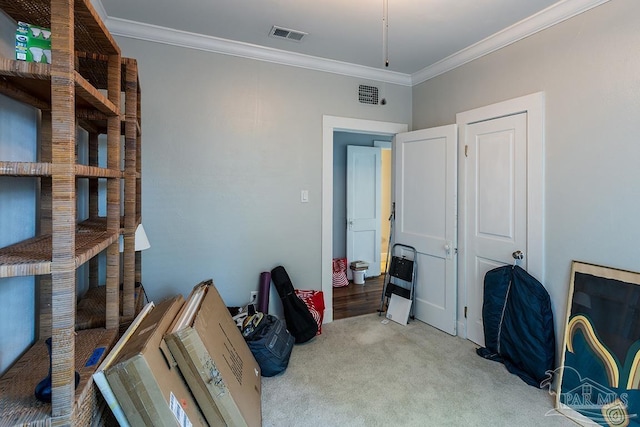 office area featuring carpet flooring, crown molding, and visible vents