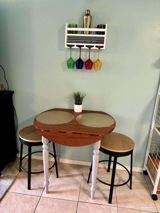 tiled dining space with baseboards