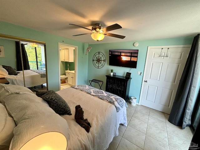 bedroom featuring ensuite bath and ceiling fan