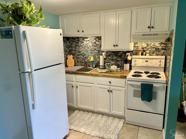 kitchen featuring a sink, white cabinets, white appliances, backsplash, and under cabinet range hood