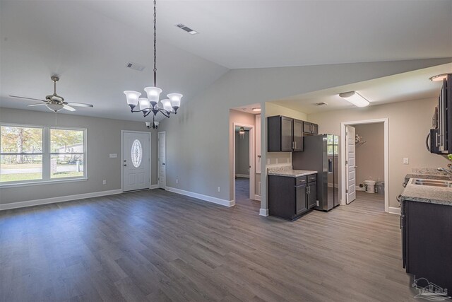 kitchen featuring lofted ceiling, dark brown cabinets, hardwood / wood-style floors, appliances with stainless steel finishes, and ceiling fan