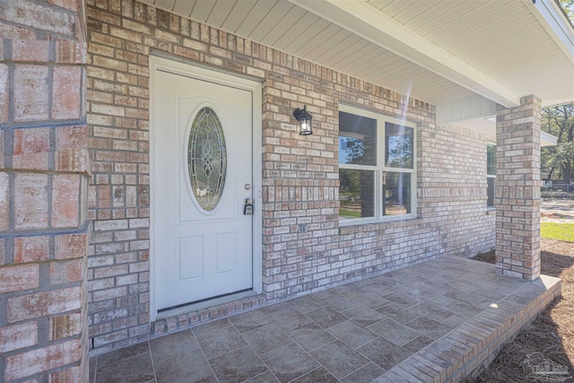 doorway to property featuring a porch