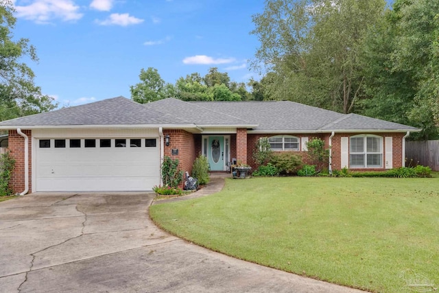 ranch-style house featuring a garage and a front yard