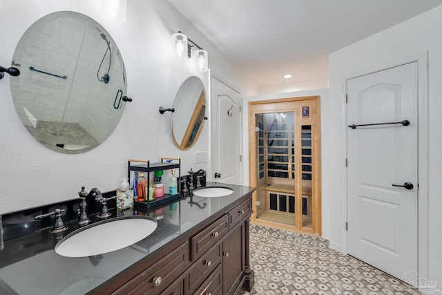 bathroom featuring a shower and vanity