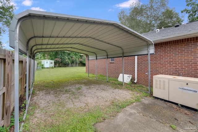 view of car parking with a lawn and a carport