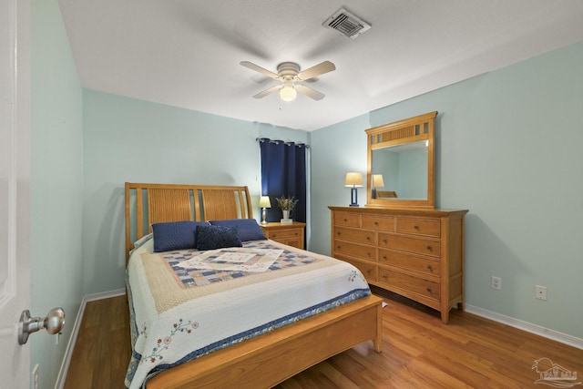 bedroom with ceiling fan and hardwood / wood-style floors