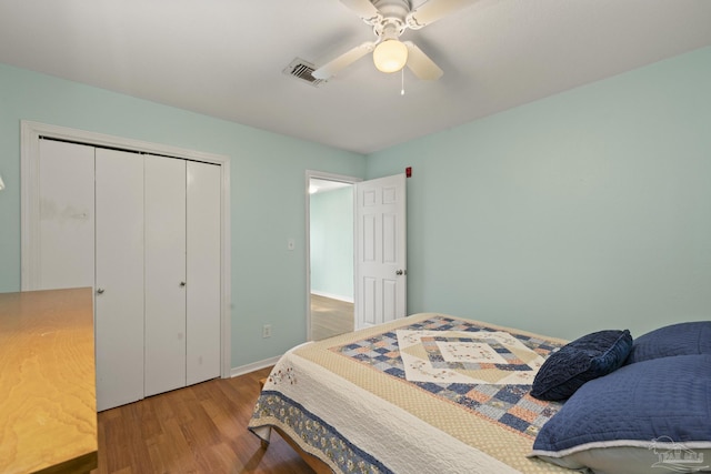 bedroom featuring ceiling fan, a closet, and wood-type flooring