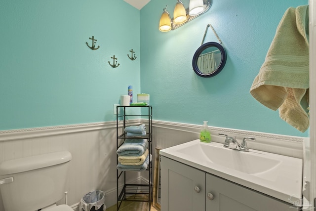 bathroom with toilet and vanity