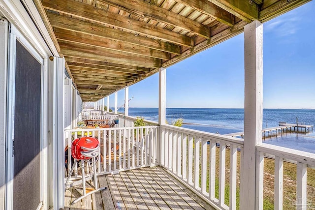 balcony with grilling area and a water view