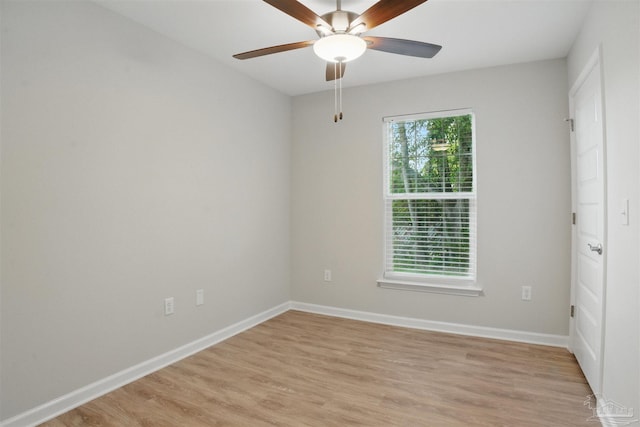 1002 Yonge St, Pensacola, FL 32501 - spare room with a ceiling fan, light wood finished floors, and baseboards