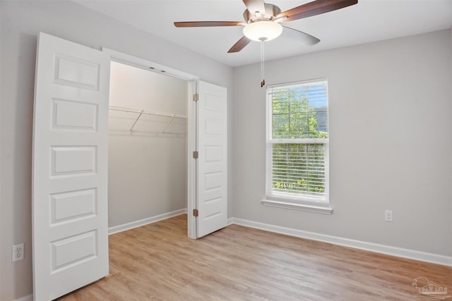 1002 Yonge St, Pensacola, FL 32501 - unfurnished bedroom with light wood-style flooring, baseboards, a closet, and ceiling fan