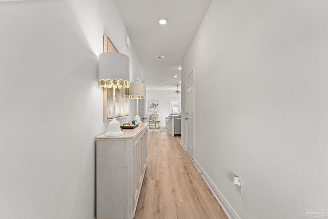 hallway with light wood-type flooring