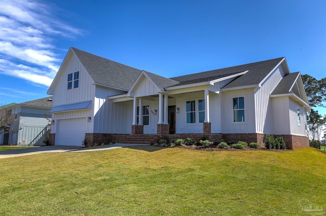 view of front of property with brick siding, board and batten siding, a garage, driveway, and a front lawn