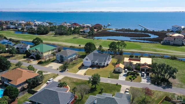 aerial view featuring view of golf course, a water view, and a residential view