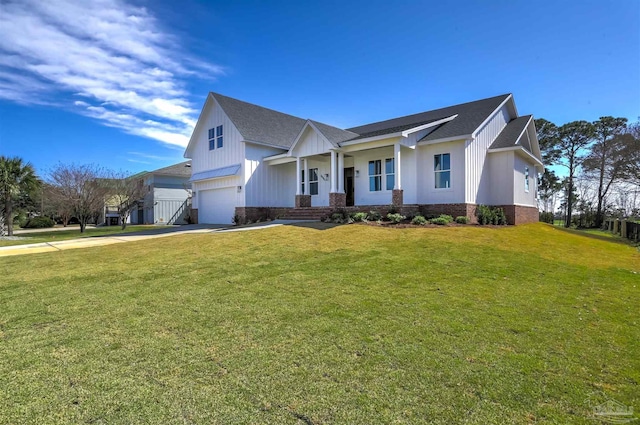 view of front of home with an attached garage, board and batten siding, a front lawn, and concrete driveway