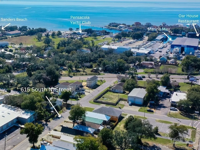 birds eye view of property featuring a water view and a residential view