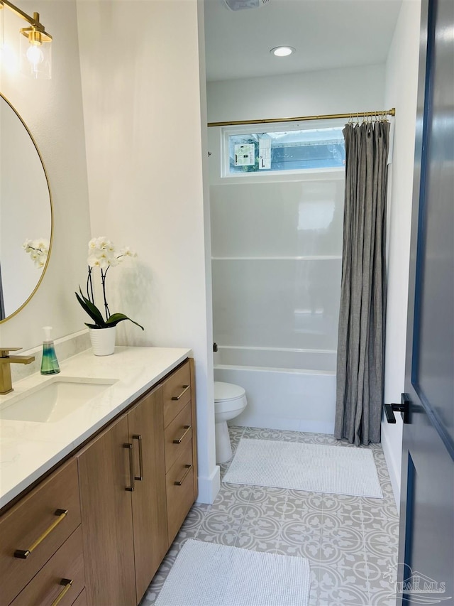 full bathroom with shower / bathtub combination with curtain, tile patterned flooring, vanity, and toilet