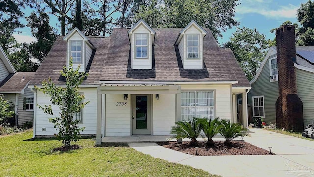 2708 Willow Grove Ln, Ft Walton Beach, FL 32547 - cape cod-style house with a front yard and a shingled roof