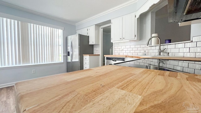 2708 Willow Grove Ln, Ft Walton Beach, FL 32547 - kitchen with stainless steel appliances, wooden counters, ornamental molding, decorative backsplash, and white cabinets