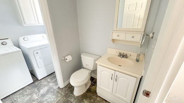 2708 Willow Grove Ln, Ft Walton Beach, FL 32547 - bathroom with washing machine and dryer, toilet, and vanity