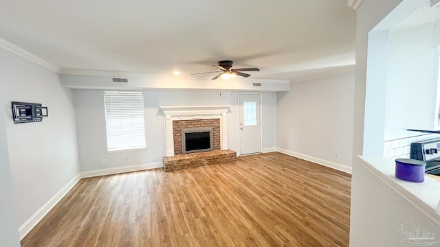 2708 Willow Grove Ln, Ft Walton Beach, FL 32547 - unfurnished living room with ornamental molding, a ceiling fan, light wood finished floors, baseboards, and a brick fireplace