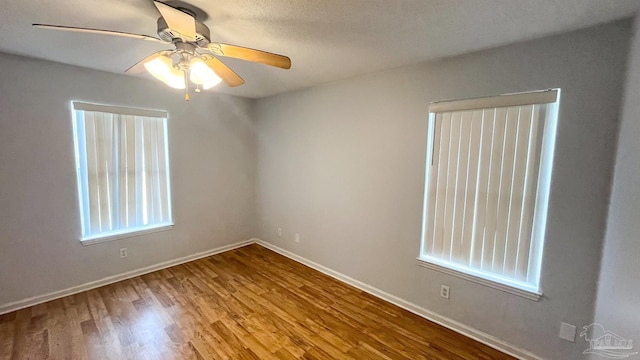 2708 Willow Grove Ln, Ft Walton Beach, FL 32547 - empty room with a ceiling fan, wood finished floors, baseboards, and healthy amount of natural light
