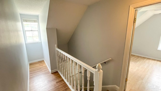 2708 Willow Grove Ln, Ft Walton Beach, FL 32547 - stairs with wood finished floors, baseboards, and lofted ceiling