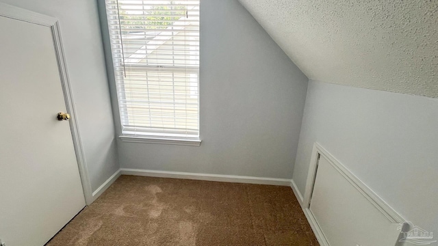 2708 Willow Grove Ln, Ft Walton Beach, FL 32547 - bonus room with vaulted ceiling, carpet flooring, a textured ceiling, healthy amount of natural light, and baseboards