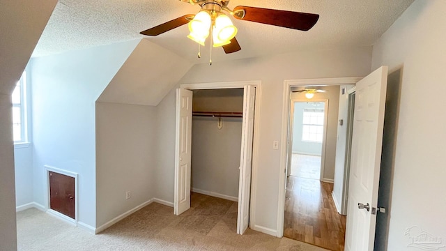 2708 Willow Grove Ln, Ft Walton Beach, FL 32547 - unfurnished bedroom featuring a closet, a textured ceiling, ceiling fan, light carpet, and baseboards