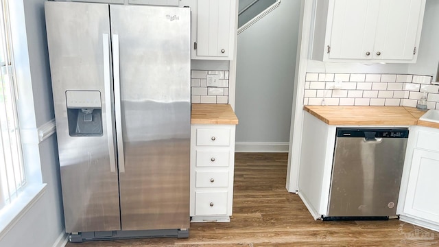 2708 Willow Grove Ln, Ft Walton Beach, FL 32547 - kitchen with appliances with stainless steel finishes, wooden counters, wood finished floors, and backsplash