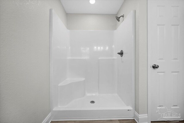 bathroom featuring walk in shower