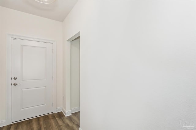 3975 Morning Dew Dr, Milton, FL 32583 - corridor featuring baseboards and dark wood-type flooring