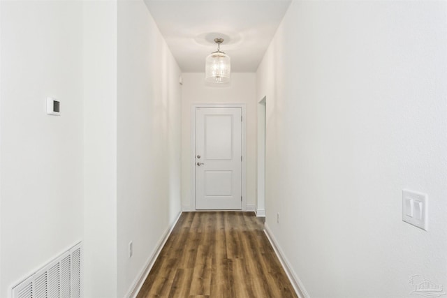 3975 Morning Dew Dr, Milton, FL 32583 - hallway with dark wood-type flooring and baseboards